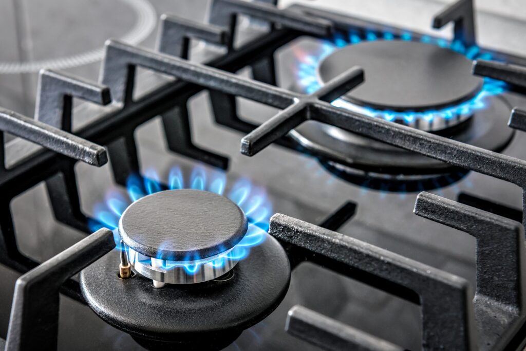 Why the flame of gas stoves is blue and what it means when it turns yellow-red