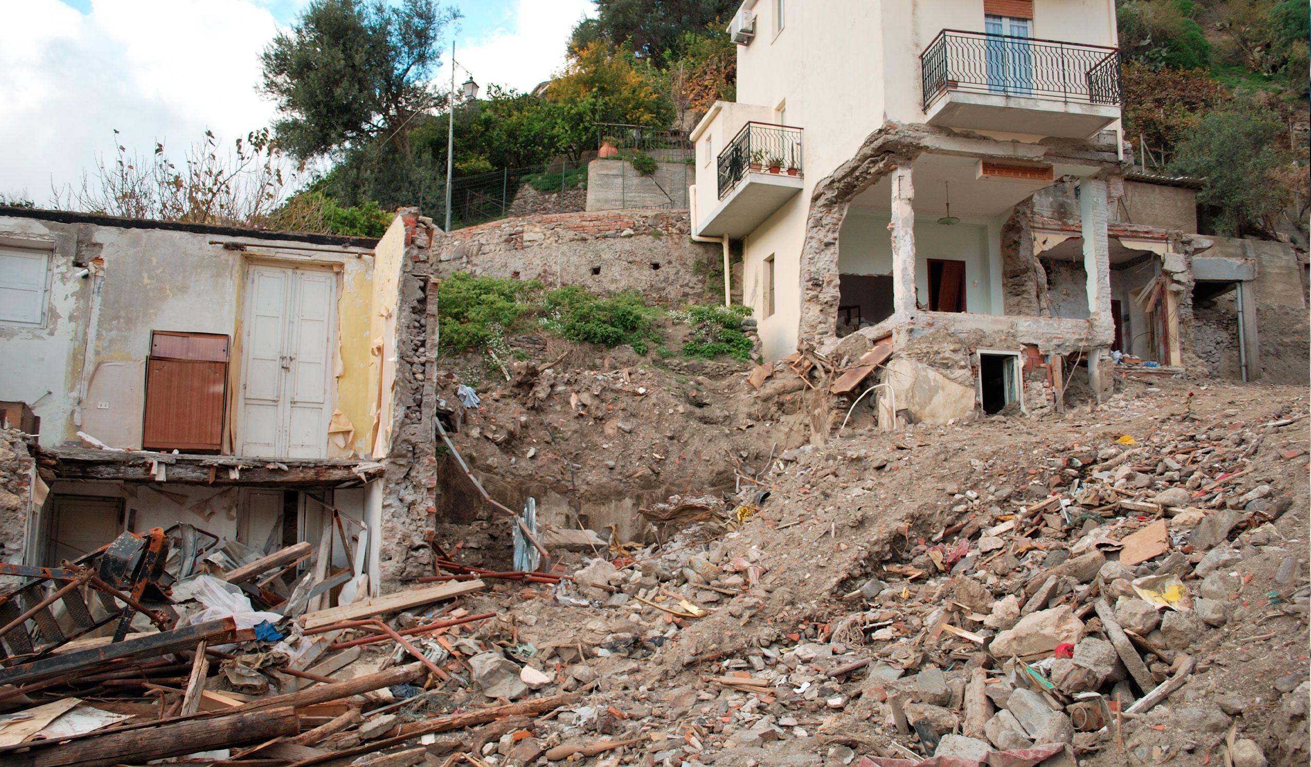 What is a landslide and how is it studied from a geotechnical point of view