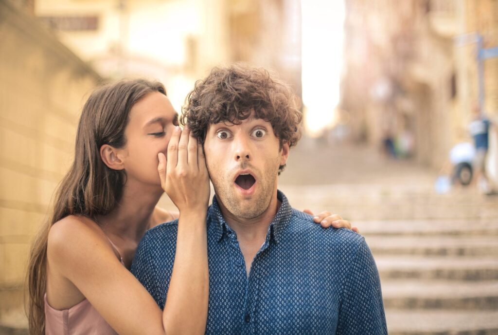 Why do they say "gossip" and who between men and women gossips more?
