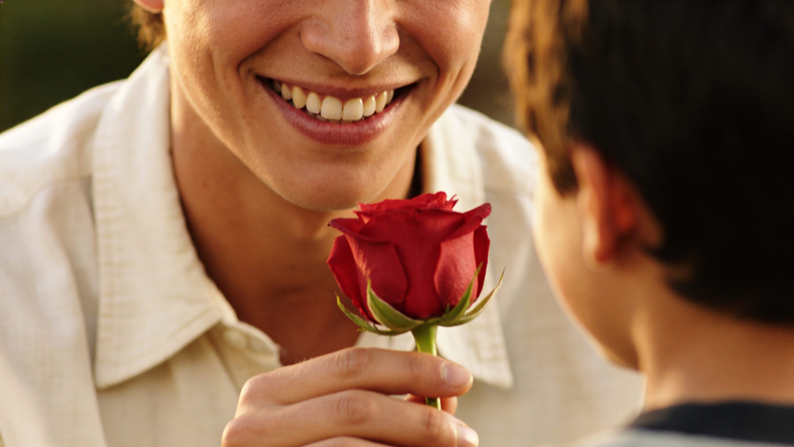 Because in some cultures (like Russian or Japanese) smiling is not a sign of kindness