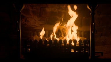 House of the Dragon 3 - a skull burns in the fireplace