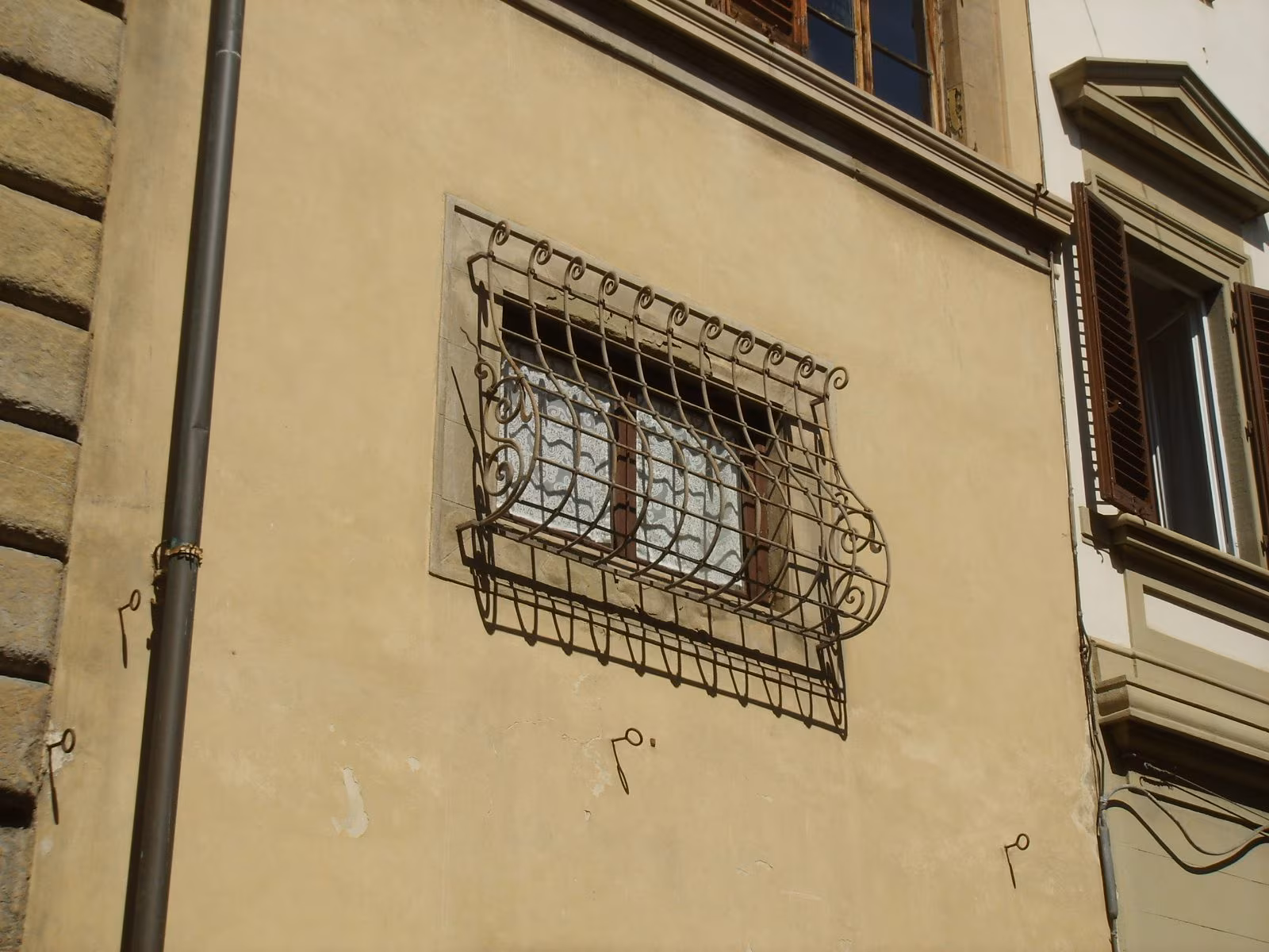 Why do some windows have curved grates: in architecture they are used to have external space and ventilation